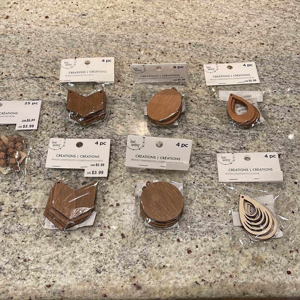 Set of seven packages of wood components for crafts